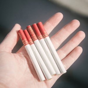 white and red cannabis cigarettes