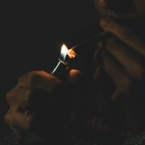 dark image person lighting joint