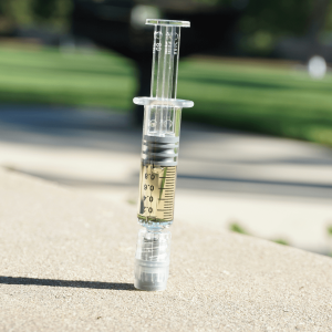 light gold oil syringe