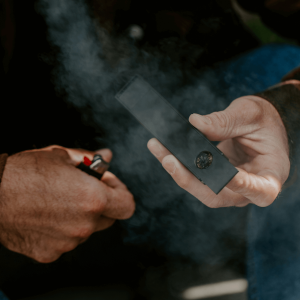 person lighting pipe