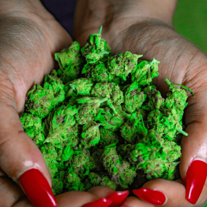 red nails and bright green flower