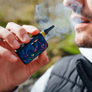 man smoking cannabis cart