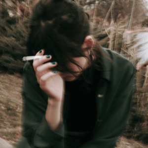 blurry image of girl smoking joint