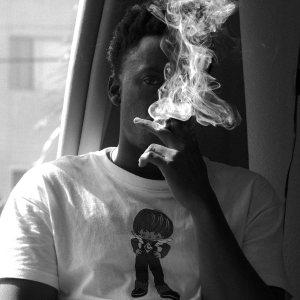 black and white image of man smoking
