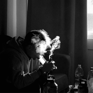 black and white image of hitting bong